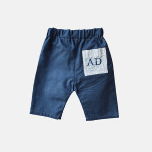 PANTALONE IN COTONE TINTA UNITA CON TASCA RICAMATA