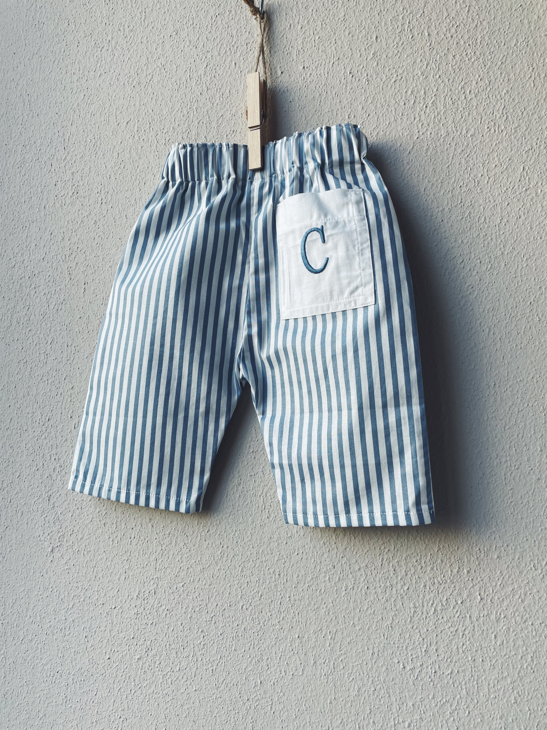 PANTALONE IN COTONE FANTASIA CON TASCA RICAMATA